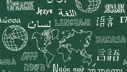 A word ‘language’ written with chalk on a board in many different languages.